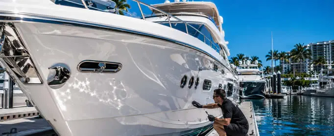 Certified Yacht Armor™ Marine Protection Film installation on yacht hull.